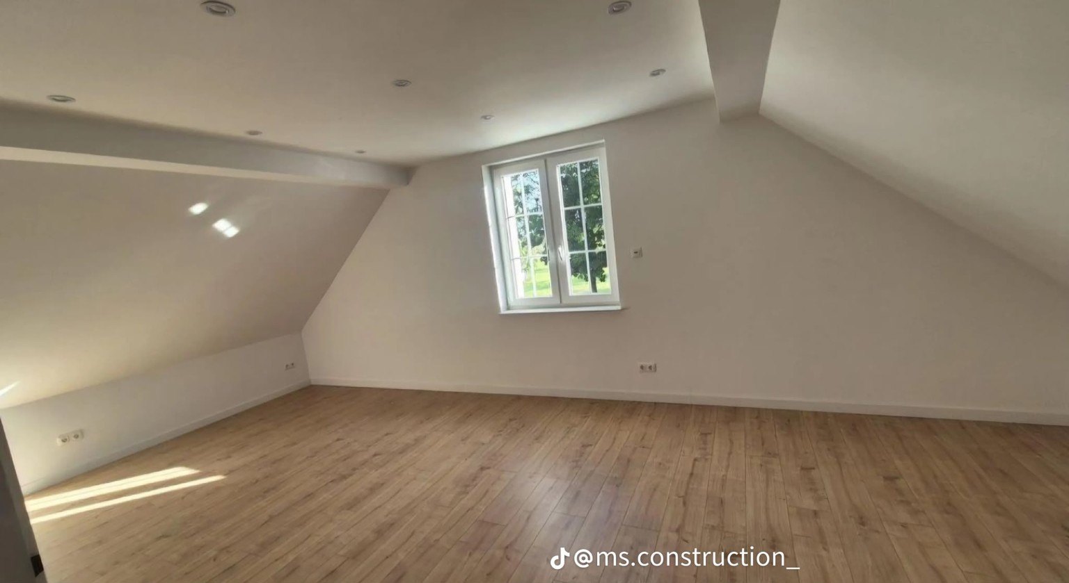 Attic interior with recessed lighting
